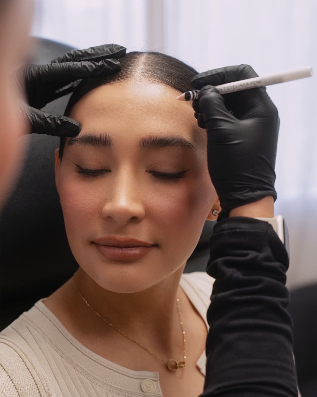 NakedMD provider performing a forehead TOX treatment